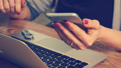 Girl with the with Macbook and iPhone