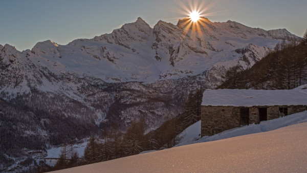 Sunstar over the mountains