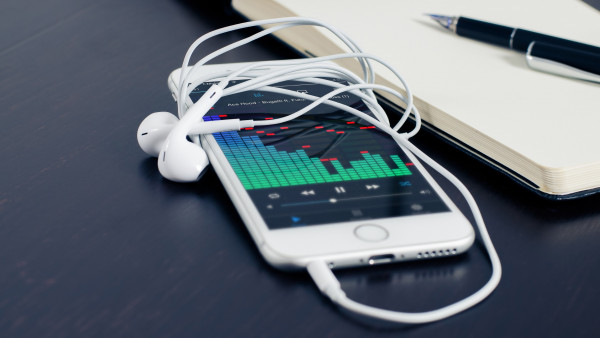 Music plays on the iPhone's earphones