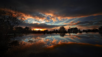 Fire sunset reflecting on lake