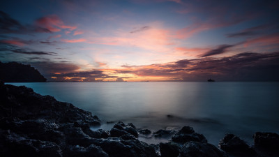 Sunset, rocks, clouds, view from Thailand